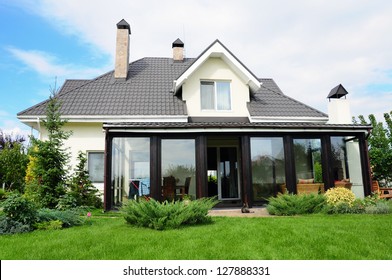 A New House With A Garden In A Rural Area Under Beautiful Sky