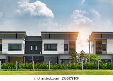 New house for sale or rent on blue sky background. Real Estate concept,copy space,A row of new townhouses or condominiums.