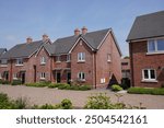 New housing estate in suburban UK town. new build houses in residential development. Property real estate 