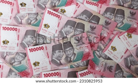 New IDR Indonesian Rupiah the official currency of Indonesia in 2022. Business Loan Income Money Investment Economy and Finance Concept Uang 100000 100.000 Rupiah.