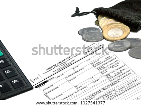 New Indian Taxation From, showing Calculator, ITR-1 Income tax Form,  10 rupee Coins, 