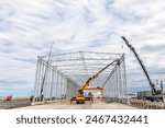 A new industrial building is installation with steel structure.