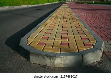 New Infiltration Parking Lot Made Of Concrete Tiles In A Square  Filled. In Connection With The Asphalt Road And The Sidewalk With Paving. Empty Bike And Walking Path Near Road.