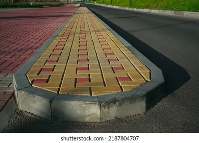 New Infiltration Parking Lot Made Of Concrete Tiles In A Square  Filled. In Connection With The Asphalt Road And The Sidewalk With Paving. Empty Bike And Walking Path Near Road.