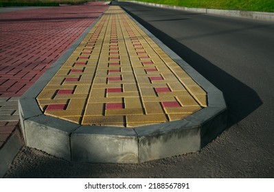 New Infiltration Parking Lot Made Of Concrete Tiles In A Square  Filled. In Connection With The Asphalt Road And The Sidewalk With Paving. Empty Bike And Walking Path Near Road.