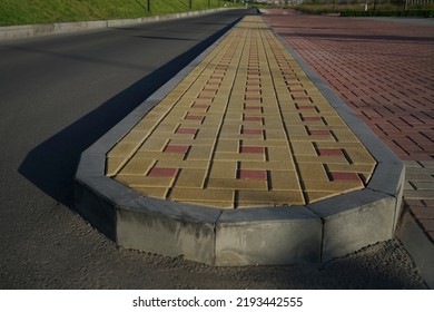 New Infiltration Parking Lot Made Of Concrete Tiles In A Square  Filled. In Connection With The Asphalt Road And The Sidewalk With Paving. Empty Bike And Walking Path Near Road.