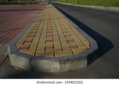 New Infiltration Parking Lot Made Of Concrete Tiles In A Square  Filled. In Connection With The Asphalt Road And The Sidewalk With Paving. Empty Bike And Walking Path Near Road.