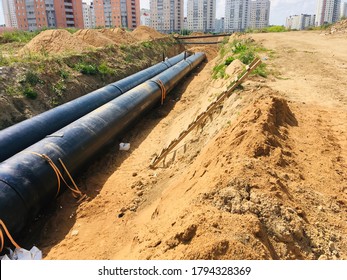 New Insulated Water Pipes In The Trench Construction Site . Urban Sewerage Infrastructure