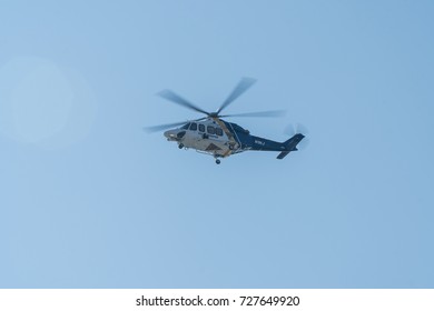 New Jersey, Circa 2017: NJ State Trooper Police Helicopter Flying High Above In The Sky. Motion Still. Visual Surveillance On Emergency Situation And Air Patrol Medical Transport