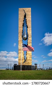New Jersey, NY, USA - Octobre 28, 2016: American Flag in front of the Tear Drop Memorial (Zurab Tsereteli) in Bayonne. A four ton nickel tear drop is suspended between the monument’s bronze elements