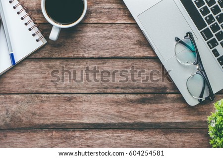 new jobs concept  / Top view of a businessman using his work computer on a desk.
