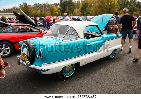 New Kent, Virginia /
United States - October 26 2019: Vintage Car and Airplane Show with
variety of colorful and restored cars and aircraft on display to
the public