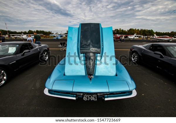 New Kent, Virginia /\
United States - October 26 2019: Vintage Car and Airplane Show with\
variety of colorful and restored cars and aircraft on display to\
the public
