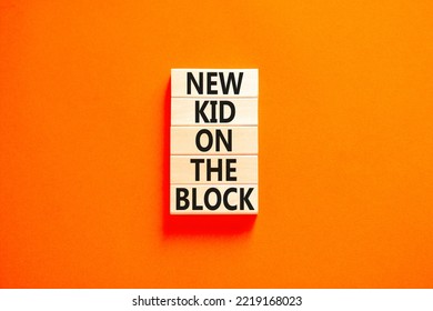 New kid on the block symbol. Concept words New kid on the block on wooden blocks. Beautiful orange table orange background. Business and new kid on the block concept. Copy space.