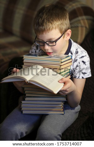 Similar – boy reading books