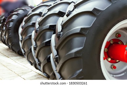 New, large tractor wheels close up - Shutterstock ID 1830503261