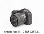 New latest model interchangeable lens digital camera for content creators on white isolated background