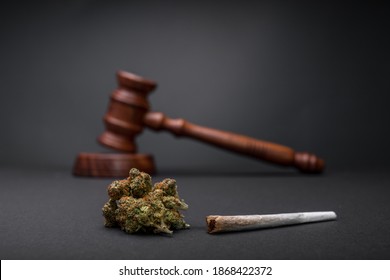 New Law - Legalize Marijuana. Wooden judge hammer. Cannabis legalization as medical drug. CBD healing social issue concept. Legality of cannabis, legal and illegal cannabis.
