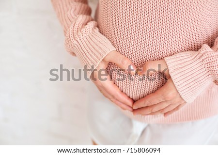 new life birth concept happy woman pregnancy female holding hands symbol heart white background selective focus.