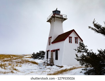 New London Lighthouse Historic Light Station Building In Kensington County Of Prince Edward Island, PEI, Canada, In Winter With Snowy Sand Dunes