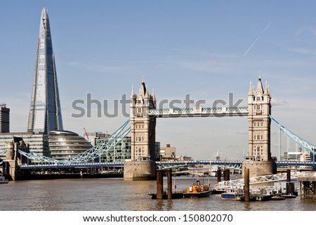 New London skyline with Tower Bridge and the new The Shard skyscraper by Renzo Piano. 