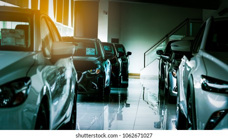New luxury compact car parked in modern showroom for sale. Car dealership office. Car retail shop. Electric car technology and business concept. Automobile rental concept.