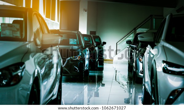 New luxury\
compact car parked in modern showroom for sale. Car dealership\
office. Car retail shop. Electric car technology and business\
concept. Automobile rental\
concept.