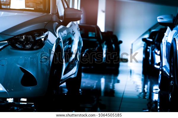 New luxury compact\
car parked in modern showroom for sale. Car dealership office. Car\
retail shop.