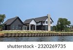 New luxury new house under construction with river seawall