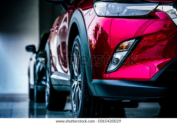 New luxury\
SUV compact car parked in modern showroom for sale. Car dealership\
office. Car retail shop. Electric car technology and business\
concept. Automobile rental\
concept.