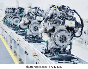 New manufactured car engines on automated production assembly line in a car factory. Manufacture of the engines for new car. New automotive engine on production line. - Shutterstock ID 572424982