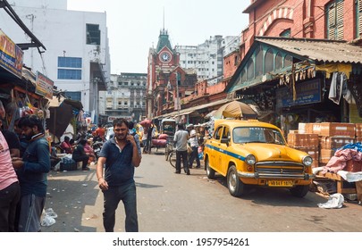 New Market, Kolkata, 03-27-20: Local People And Market Vendors Walking Through Congested Street Near The Iconic Hog Market, A Heritage Building. Though Pandemic Time, No One Is Wearing Face Mask.