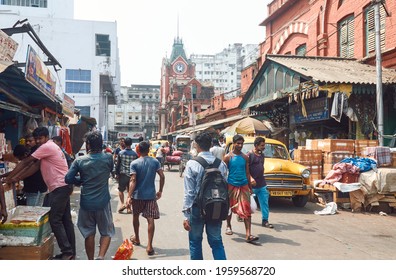 New Market, Kolkata, 03-27-20: Local People And Market Vendors Walking Through Congested Street Near The Iconic Hog Market, A Heritage Building. Though Pandemic Time, No One Is Wearing Face Mask.