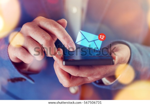 New messages on mobile\
phone, female finger opening inbox to view the pending e-mail\
communication