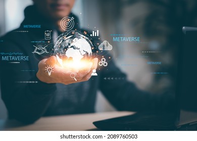 New metaverse with icon business concept,Business hand holding a virtual globe with financial icons future technology, business goals, online communication,graph Screen Icon of a media screen,big data - Shutterstock ID 2089760503