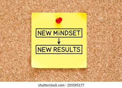 New Mindset New Results Written On A Yellow Sticky Note Pinned On A Bulletin Board.