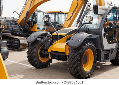 New mini excavators in the same row in the agricultural machinery store
