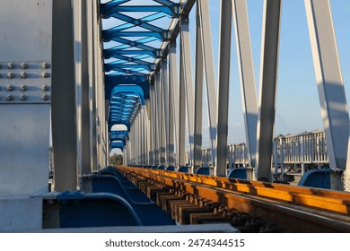 A new model steel frame railway bridge over the Brantas River connecting Mojokerto station with the Tarik station