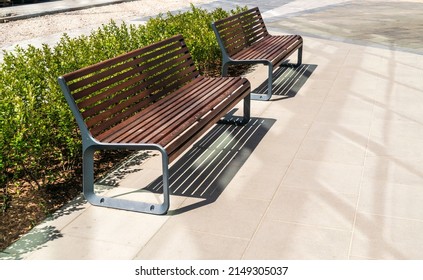 New modern bench in park. Outdoor city architecture, wooden benches, outdoor chair, urban public furniture, empty plank seat, comfortable bench in recreation area - Shutterstock ID 2149305037