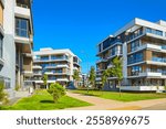 New modern block of flats in green area. residential apartment with flat buildings exterior. luxury house complex. Part of City Real estate property, condo architecture. apartment insurance concept.