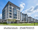 New modern block of flats in green area. residential apartment with flat buildings exterior. luxury house complex. Part of City Real estate property, condo architecture. apartment insurance concept.