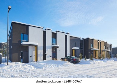 New modern block of flats in green area at winter. residential apartment with flat buildings exterior. luxury house complex covered snow. City Real estate property condo architecture insurance concept - Powered by Shutterstock