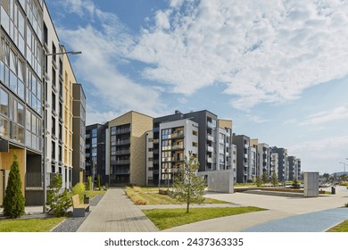 New modern block of flats in green area. residential apartment with flat buildings exterior. luxury house complex. Part of City Real estate property, condo architecture. apartment insurance concept. - Powered by Shutterstock