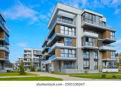 New modern block of flats in green area. residential apartment with flat buildings exterior. luxury house complex. Part of City Real estate property, condo architecture. apartment insurance concept.