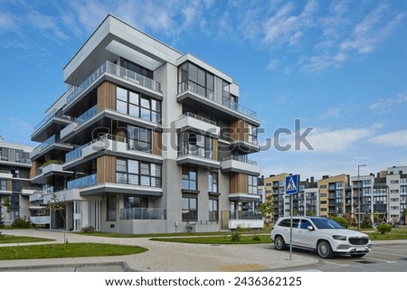 New modern block of flats in green area. residential apartment with flat buildings exterior. luxury house complex. Part of City Real estate property, condo architecture. apartment insurance concept.