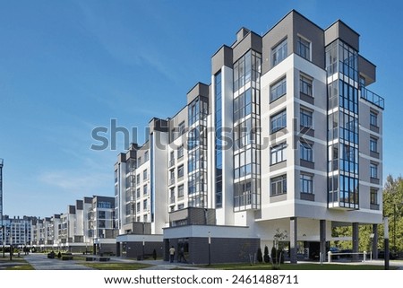 Similar – Image, Stock Photo Balconies of a new building block in the countryside with a red parasol / balcony