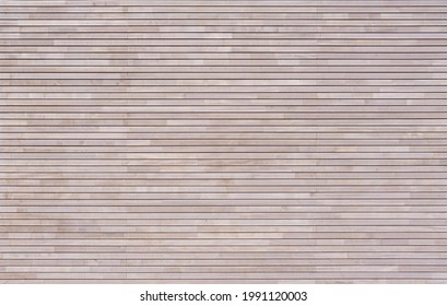 New Modern Bright Wood Cladding Made Of Horizontal Battens On A Facade