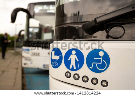 New modern busses on LPG. International Symbol of Access - Wheelchair Symbol (handicapped, physically challenged and disabled), Baby Stroller Symbol and Elderly (Old) People Symbol on the windshield.