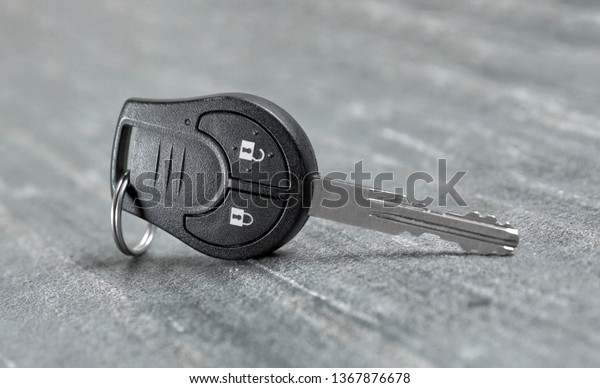 New modern car key on\
grey background