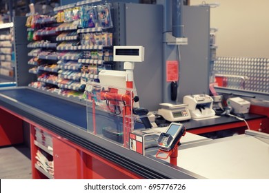 New and modern checkout terminal in a supermarket, nobody, toned image